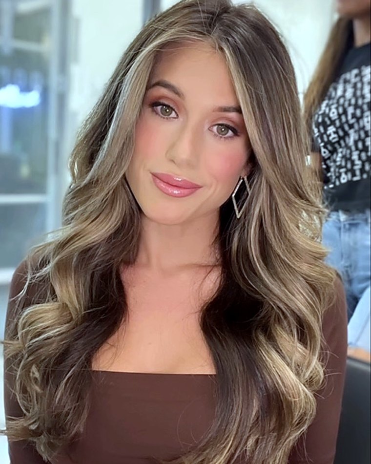 Long, full brunette-to-blonde hair with added length and body